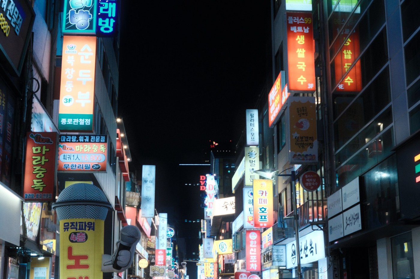 Korean street signage and neon signs representing Konglish words