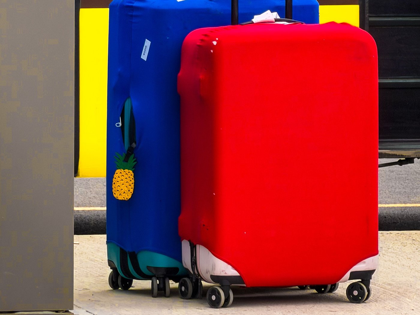 Large suitcases waiting to be sent from the airport for same-day hotel delivery